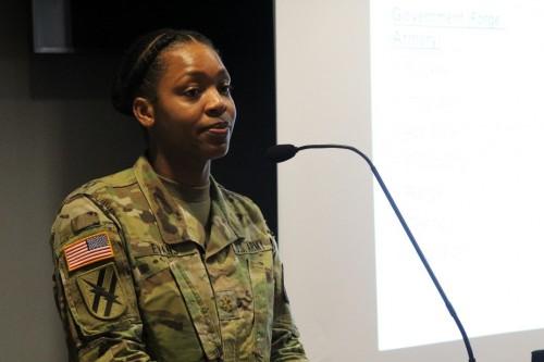 Former Assistant Program Manager (APM) Maj. Shakena Evans briefs crowd