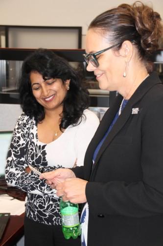 Ms. Smith visits with Ms. Tessy Joseph, maintenance functional team lead for the Logistics Modernization Program (LMP).